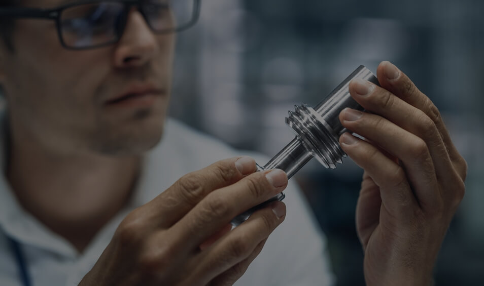 Image showing a close up of a man holding a car part